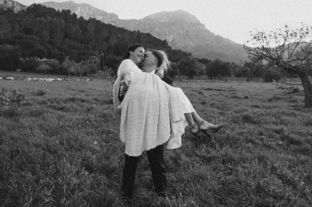 Candid moment of the couple laughing during their wedding photo session