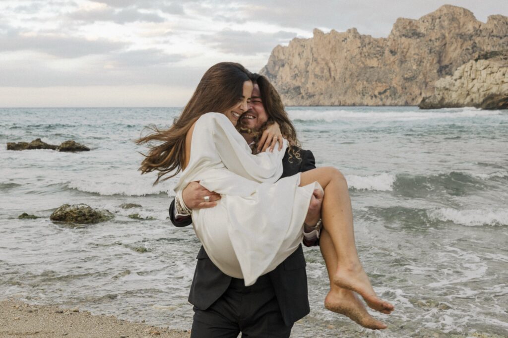 Intimate couple portrait on a clifftop overlooking the Mediterranean Sea