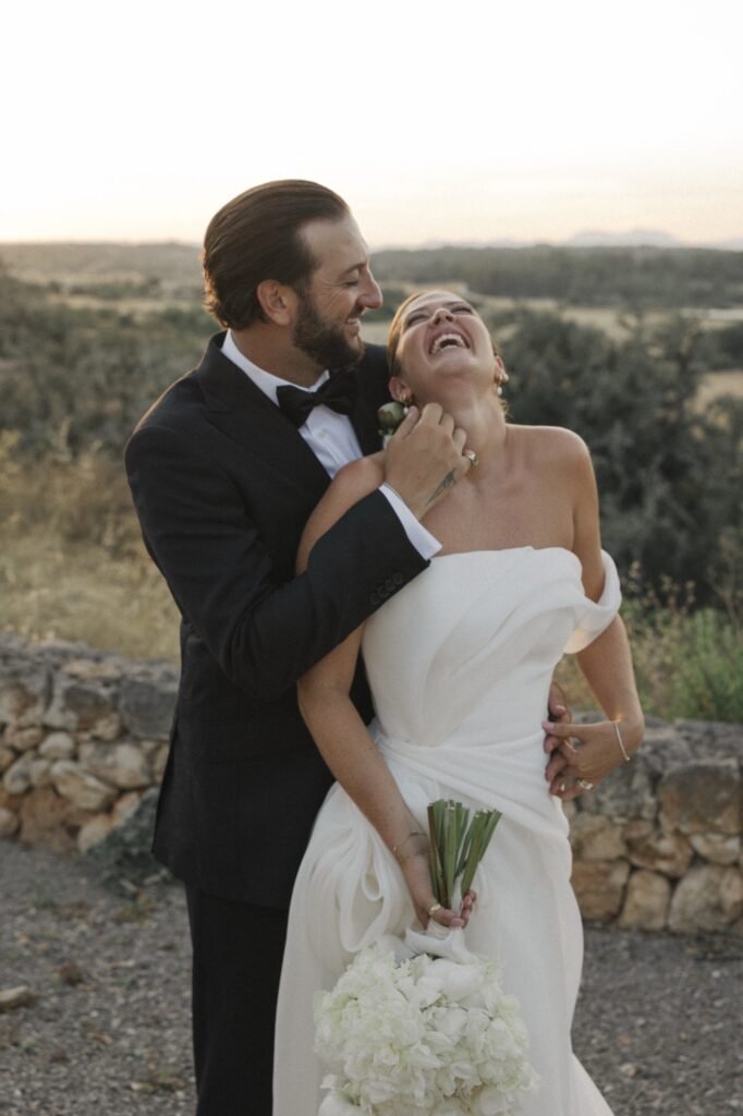 Luxury wedding couple laughing naturally in Mallorca countryside